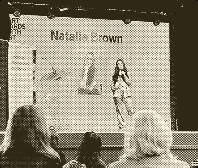 Natalie Brown presenting on stage