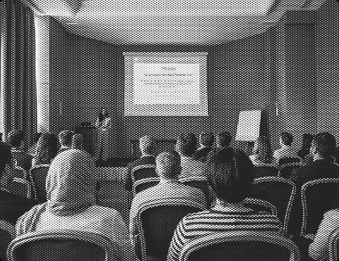 Audience attending a presentation